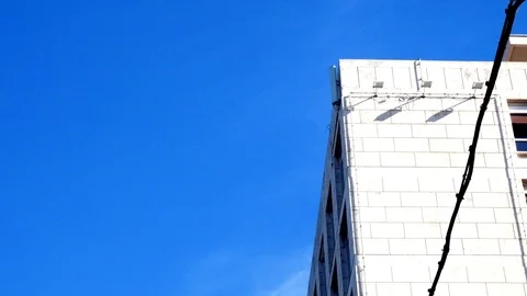 Tracking shot on the facade, with the flag of the Fao waving in the blue sky Stock Footage 88314068