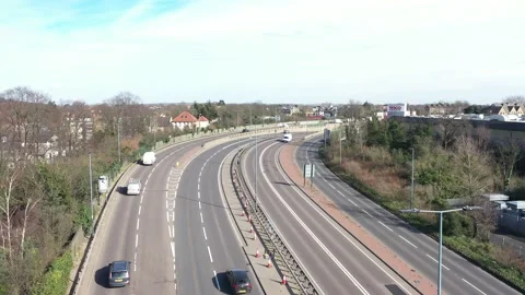 TRACKING SHOT OF FAST MOVING VEHICLES ON BUSY ROAD AERIAL Stock-Footage 149920012