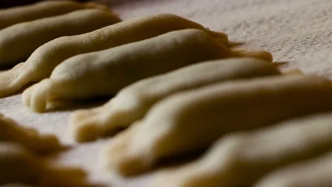 Tracking shot on a filled surface of ravioli with spinach and ricotta handmade Stock Footage 98544355