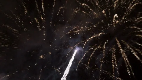 Tracking shot of a fireworks exploding in the sky Stock Footage 100390297