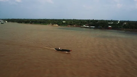 Tracking shot of fishing boat on Mekong River Stock Footage