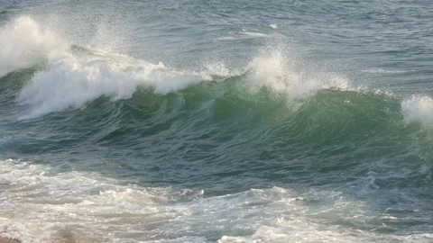 Tracking shot following a wave as it moves forward over the sea to sandy beach. Stock Footage 105164926