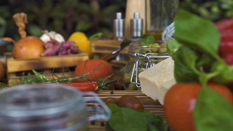 Tracking shot food composition close up. Food background from vegetable, olives Stock Footage 98483191