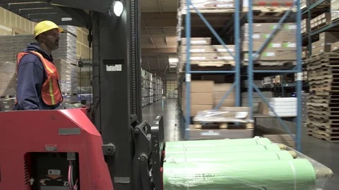 Tracking shot of a forklift driver Stock-Footage 76534629