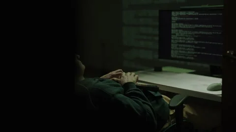 Tracking shot of freelancer coder working late at night, typing on mechanical Stock Footage 321686457