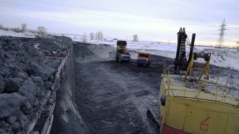 Tracking shot of freight train with copper ore arriving at the unloading Stock Footage 75068492