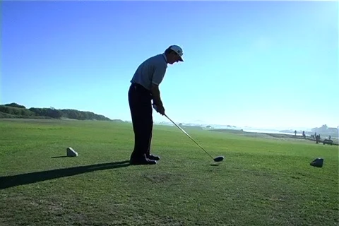 Tracking shot golf tee-off Stock Footage