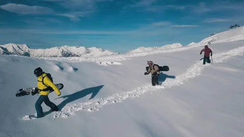 Tracking shot group of active sport backpacker wearing equipment going on white 動画素材 120833367