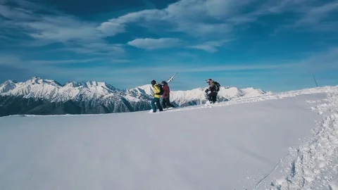 Tracking shot group of active sport backpacker wearing equipment going on white 動画素材 120834033