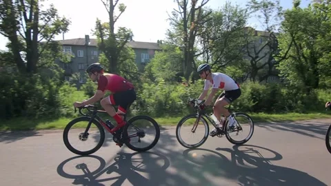 Tracking shot of a group of cyclists on country road. Stock Footage 142881309
