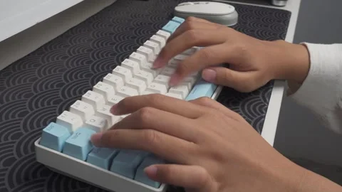 Tracking shot of hands typing on wireless keyboard Stock Footage 276586611