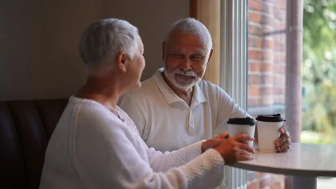Tracking shot of happy elderly couple spending quality time together, holding Stock Footage 287342367