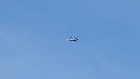 Tracking shot of helicopter flying in the sky. Vidéo 153239974