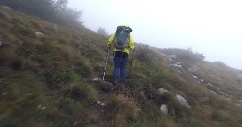 Tracking shot of a hiker going on the mountain. Stock Footage 82466047