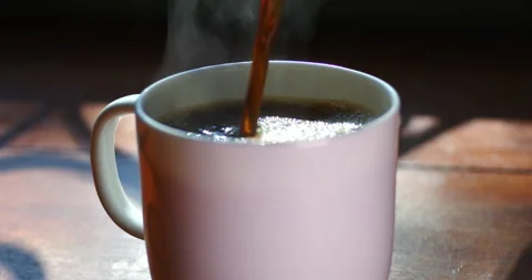 Tracking Shot of hot coffee poured into cup Stock Footage 230206567