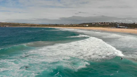 Tracking shot of a huge wave moving towards a beach, Sydney, Australia, 4K Stock Footage 105597782