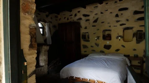 Tracking shot of the interior of a traditional stone house Stock Footage 98451616
