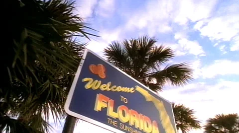 Tracking shot left to right of "Welcome to Florida" sign Stock Footage