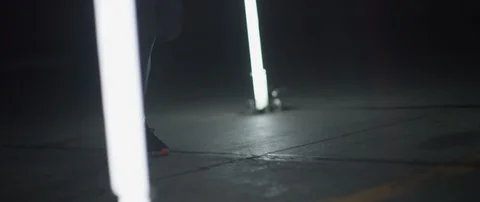 Tracking shot of legs running in hall with stick lights in slow motion, Japan Stock Footage 124661622
