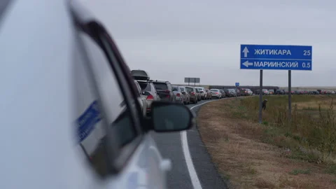 Tracking shot of long queue of cars at customs border crossing between Russia Video stock 222133841