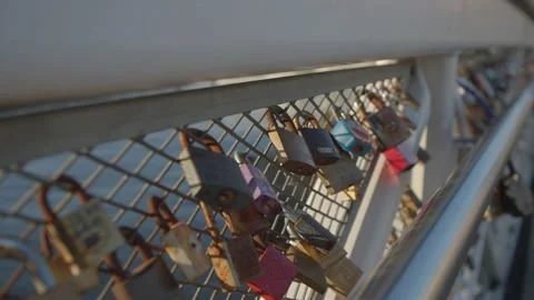 Tracking shot of lots of love locks attached to a bridge  Stock Footage 146276365
