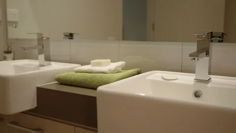 Tracking shot of luxurious bathroom basin setting. Stock Footage 93261937