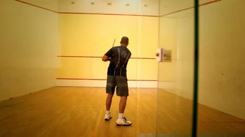 Tracking shot of man playing squash Stock Footage 11116636