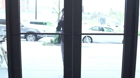 Tracking shot of a man taking the elevator Stock Footage 76235112