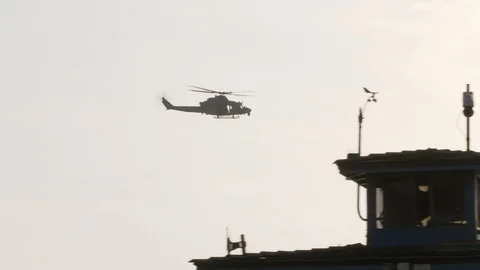 A tracking shot of a marine corp helicopter with american flag and latern Stock Footage