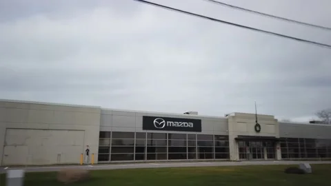Tracking Shot of Mazda Office with Empty Parking Lot Stock Footage 229956879
