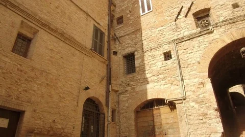 Tracking shot on medieval palace in central Assisi Stock Footage 82133049