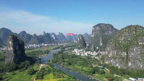 Tracking Shot of Microlight Flying Over Guilin, China Stock Footage 303283095