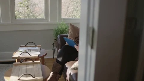 Tracking shot of millennial working on a tablet Stock Footage 70809389