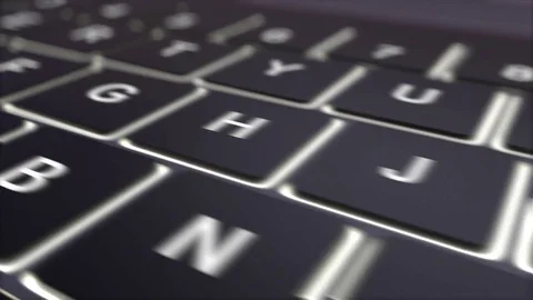 Tracking shot of modern black computer keyboard and luminous explore key Video stock 72861761