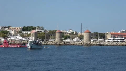 Tracking shot in motion passing Mandraki Harbor in Rhodes Stock-Footage 342976177