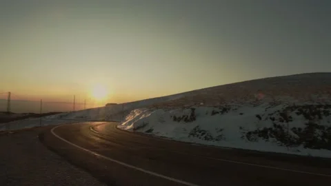 Tracking shot of a mountain road during sunset. Stock Footage 149439176