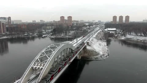 Tracking shot the movement of a high-speed passenger train on a bridge Video stock 144323955