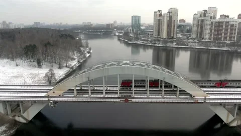 Tracking shot the movement of a high-speed passenger train on a bridge Stock Footage 144323959