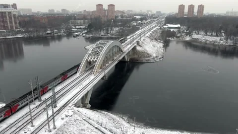 Tracking shot the movement of a high-speed passenger train on a bridge Video stock 144323965