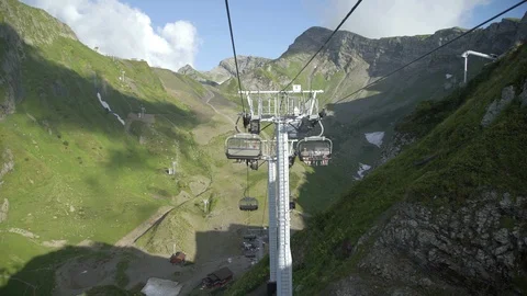 Tracking shot on moving cableway above mountain slope at summer. Amazing nature 스톡 동영상 115027691