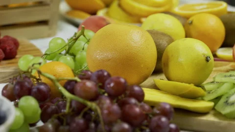Tracking shot moving over fresh, delicious fruit on kitchen counter Stock Footage 341185340