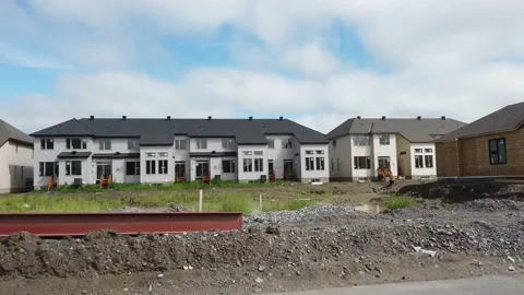 Tracking shot of new construction of homes in the suburb 4K Stock Footage 136907893