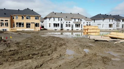 Tracking shot of new construction of homes in the suburb 4K Stock Footage 136908070