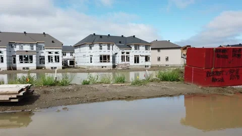 Tracking shot of new construction of homes in the suburb 4K Stock Footage 136908074