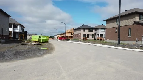 Tracking shot of new construction of homes in the suburb 4K Stock Footage 136908175