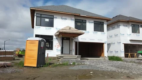Tracking shot of new construction of homes in the suburb 4K Stock Footage 136908244