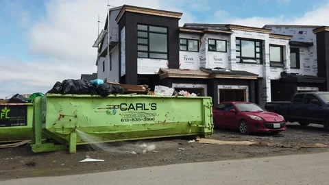 Tracking shot of new construction of homes in the suburb 4K Stock-Footage 136908331