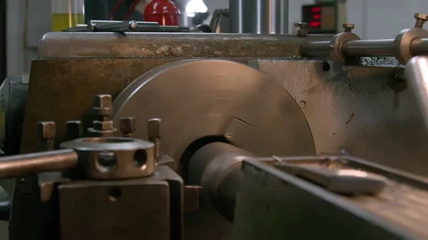 Tracking shot of an old lathe machine rotating Stock Footage 158755606