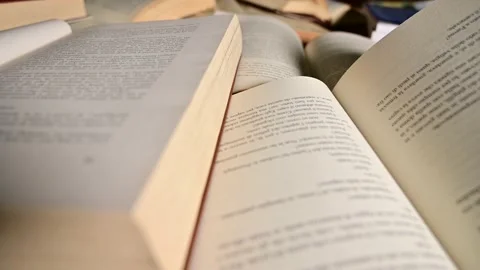 Tracking shot of opened  books Stock Footage 165422227