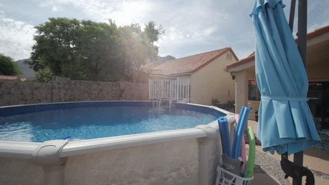 Tracking Shot Over an Above Ground Pool Stock Footage 116502362